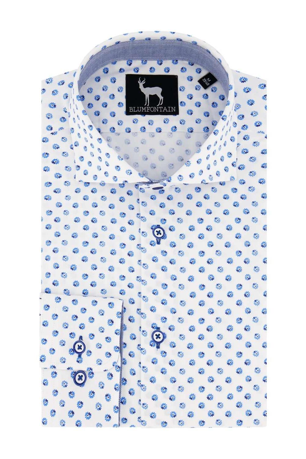 Blumfontain print madelief shirt with blue polka dots on a white background.