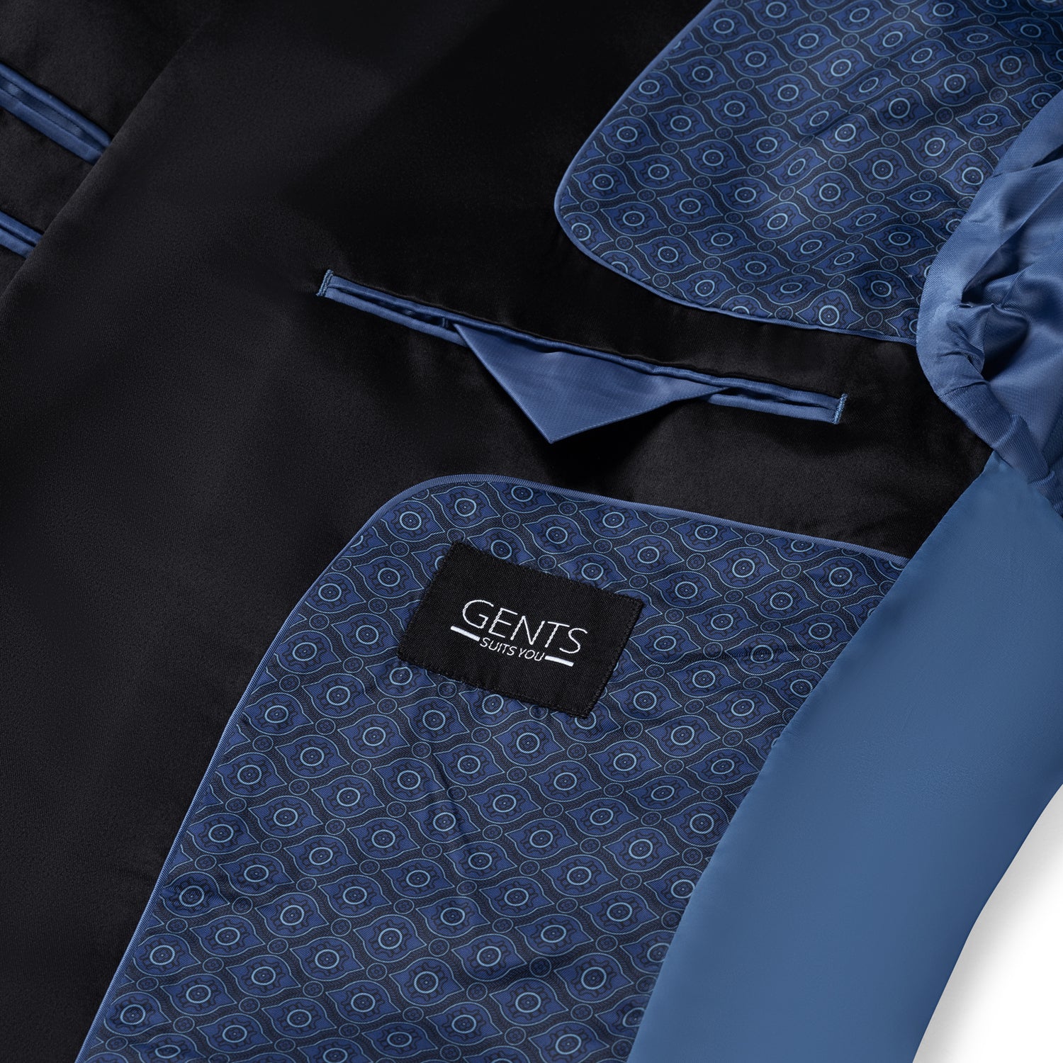 Dinnerjacket paisley velvet blauw met satijnen sjaalkraag en pochet, detail van het paisley patroon.