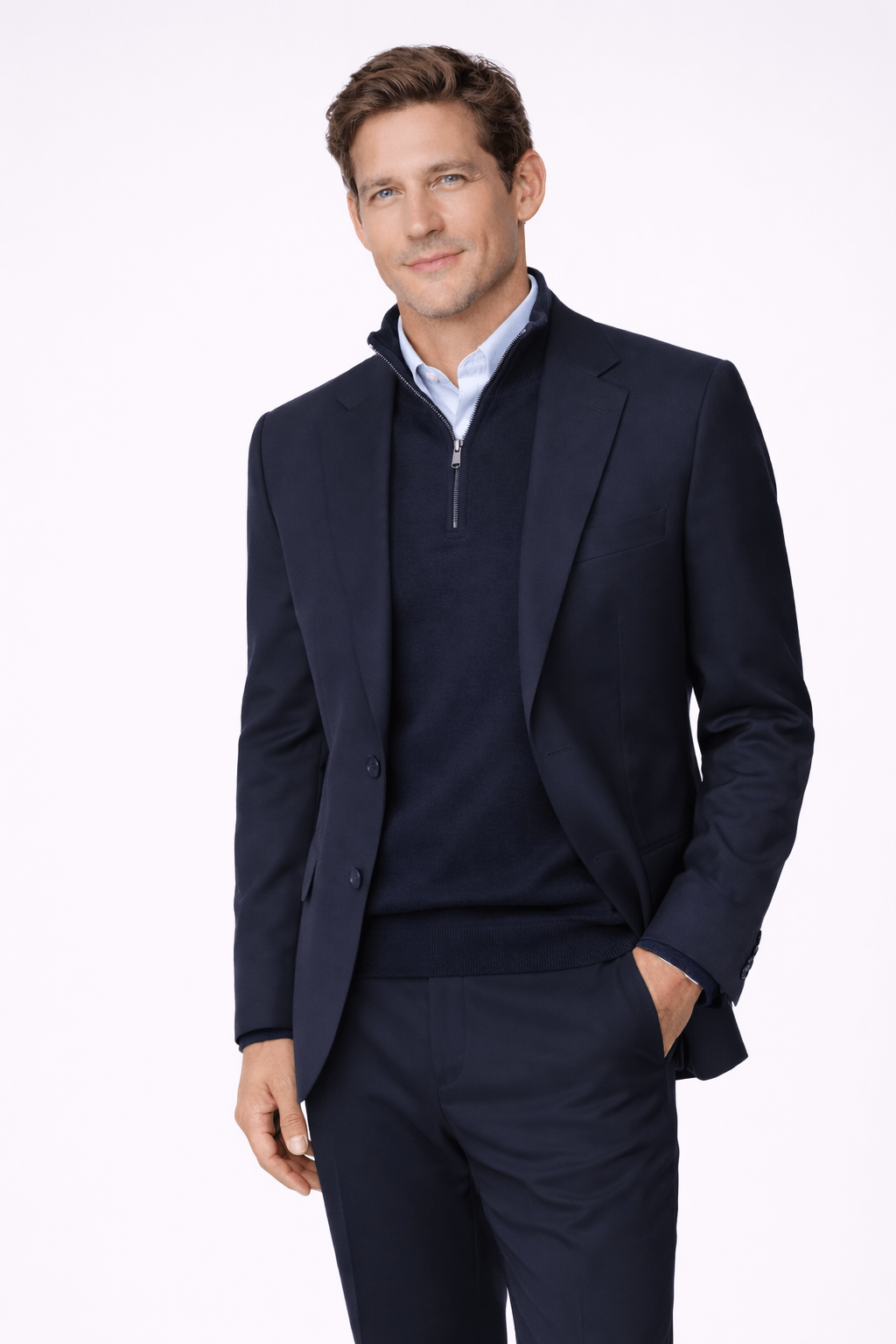 Man in a sophisticated Ton-sur-ton look with navy blazer and sweater, showcasing elegant color coordination.