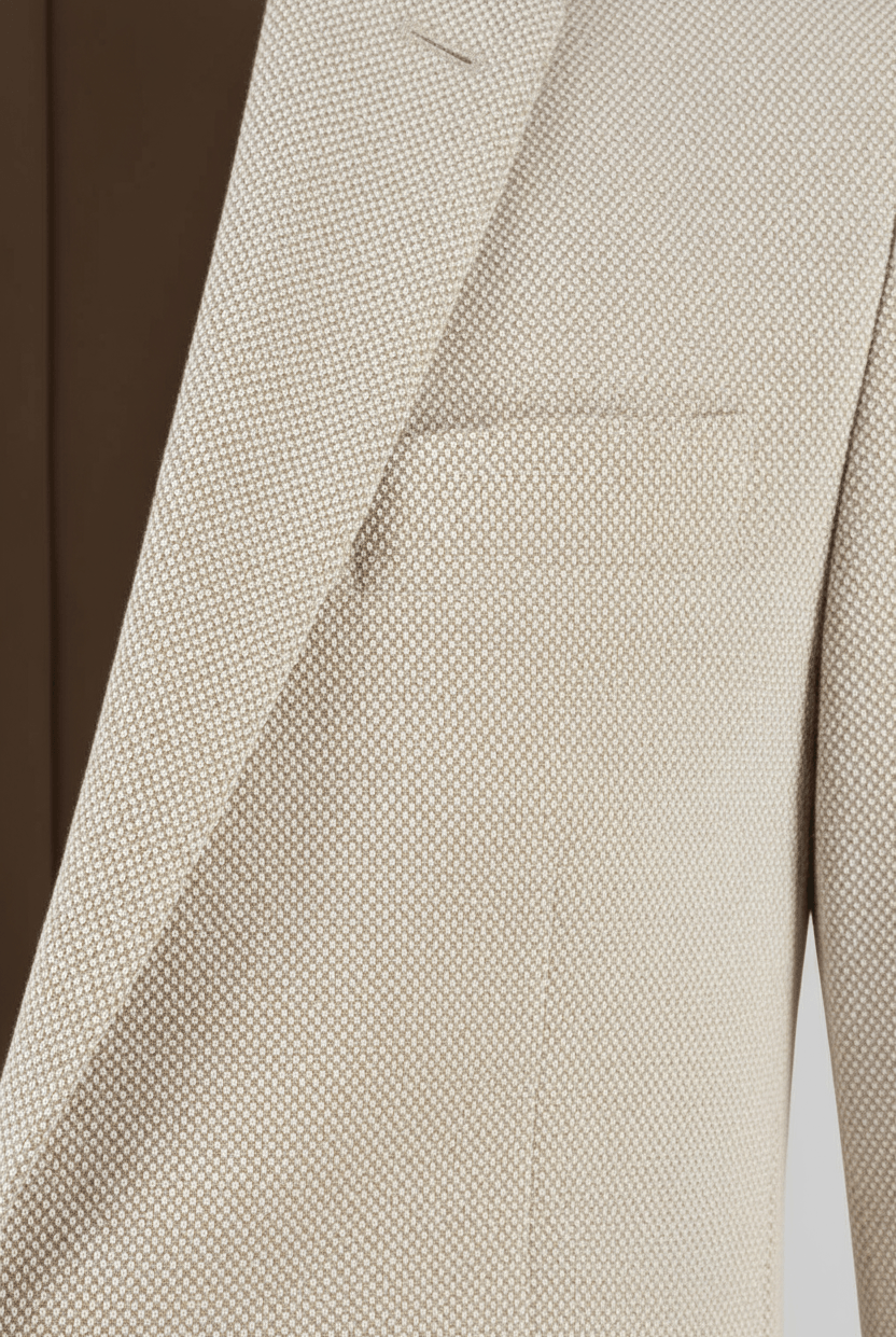 Pak 2-delig stretchkatoen zand, beige blazer met fijne textuur en zakdetails.