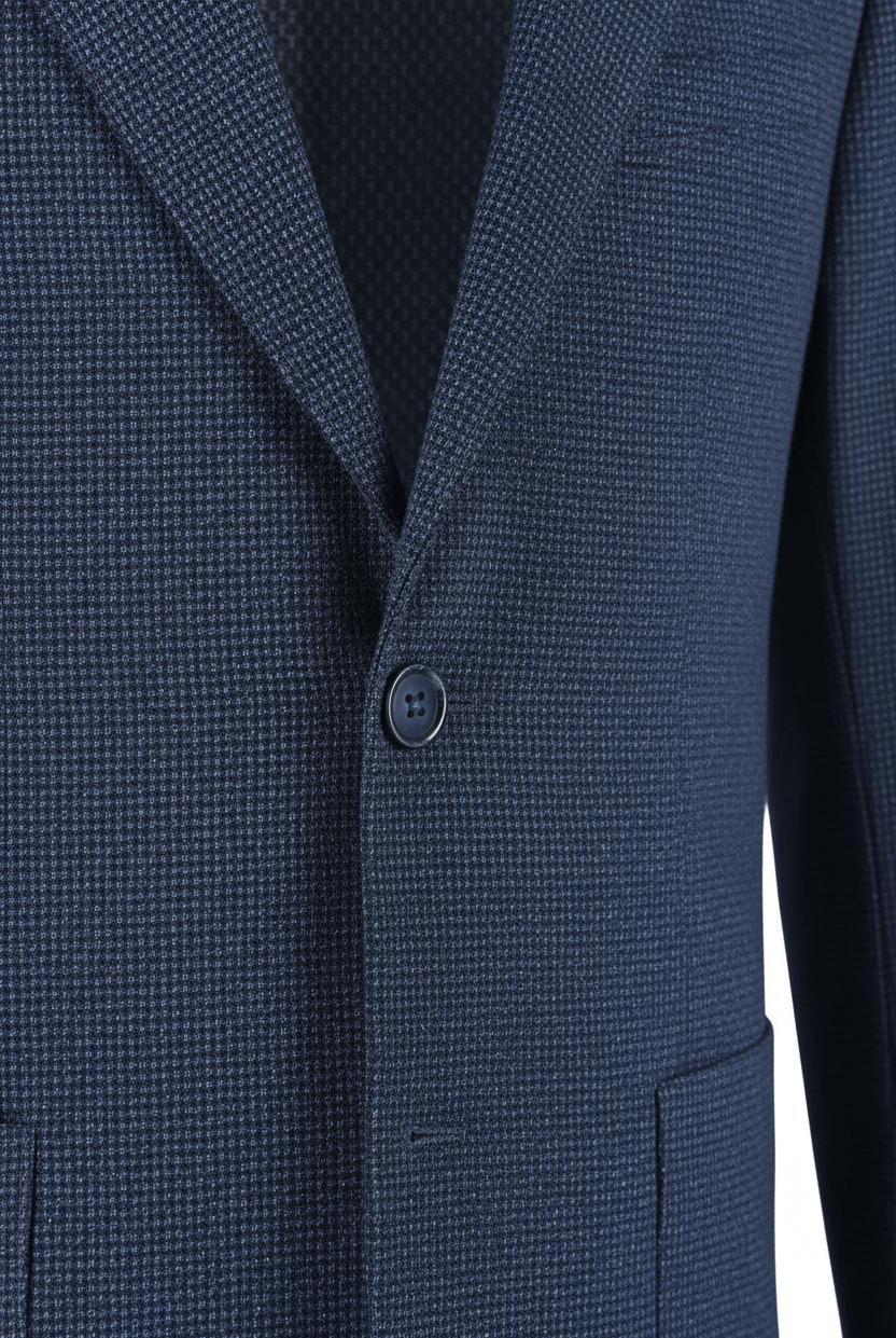 Colbert bi-stretch blauw | dicht bij de knoop en textuur van het moderne, kreukvrije colbert.