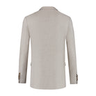 A back view of a Pak 3-delig Pebble Stone jacket showcasing its elegant texture and design.