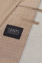 Colbert pied-de-poule beige interior detail with GENTS label and fabric pattern.