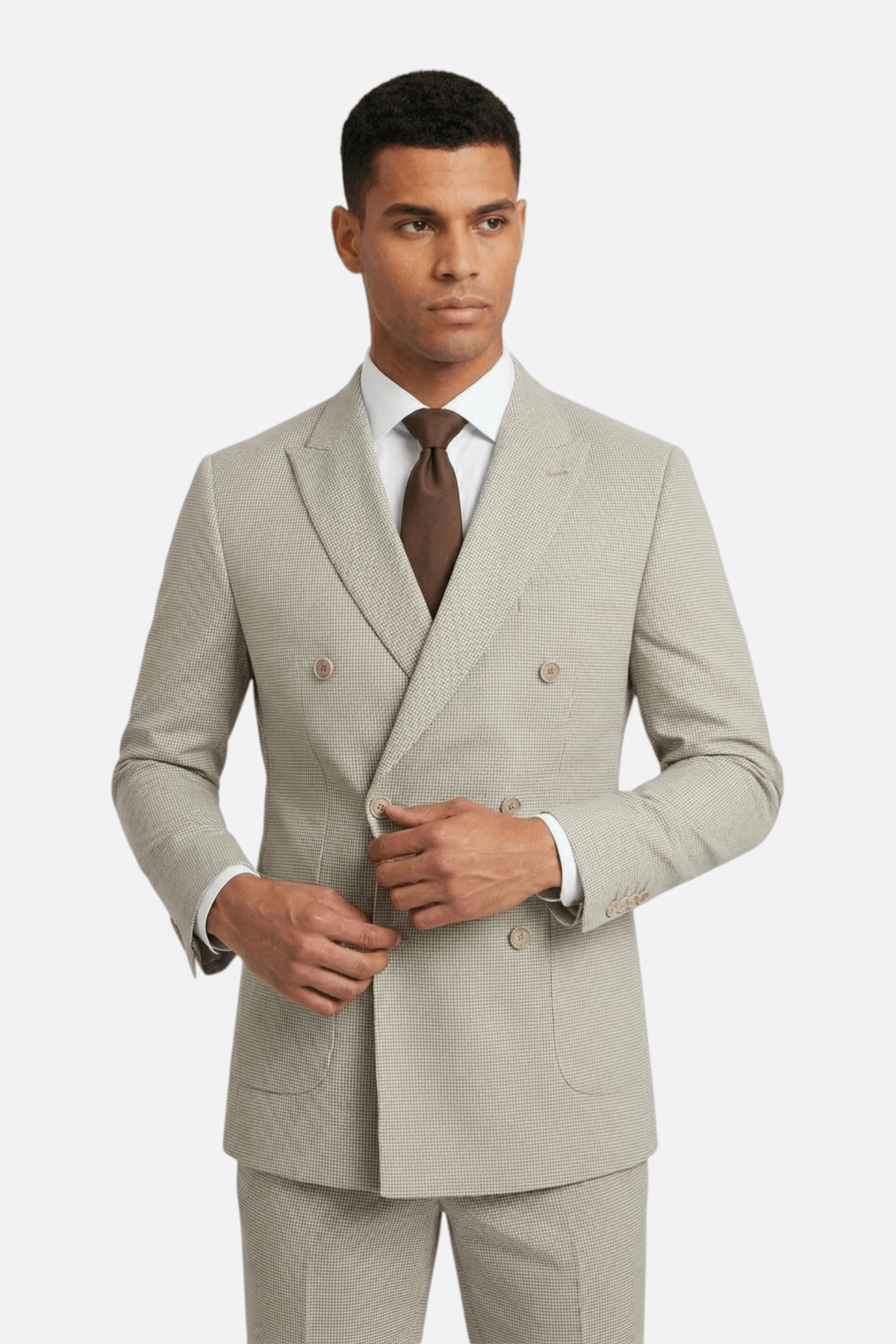Pak Double-breasted pied-de-poule beige 2-delig model wearing a stylish suit with a brown tie.